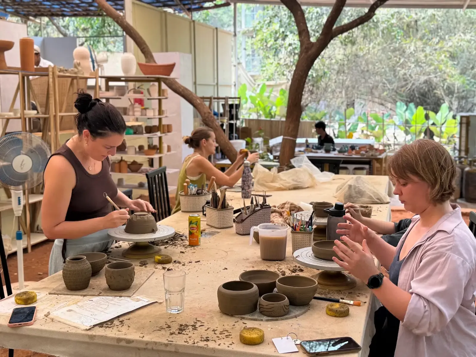 Dharamkot Studio Goa community art space and retreat sessions surrounded by greenery.